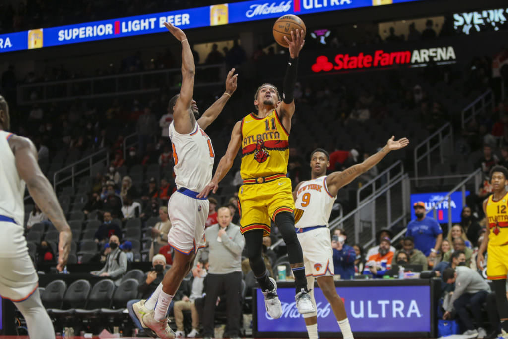Atlanta Hawks guard Trae Young (11) shoots against the New York Knicks in the second half at State Farm Arena. 
