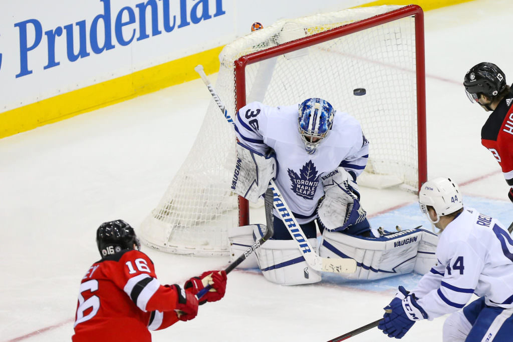 Toronto Maple Leafs goaltender Jack Campbell (36) makes a save against New Jersey Devils left wing Jimmy Vesey (16) 