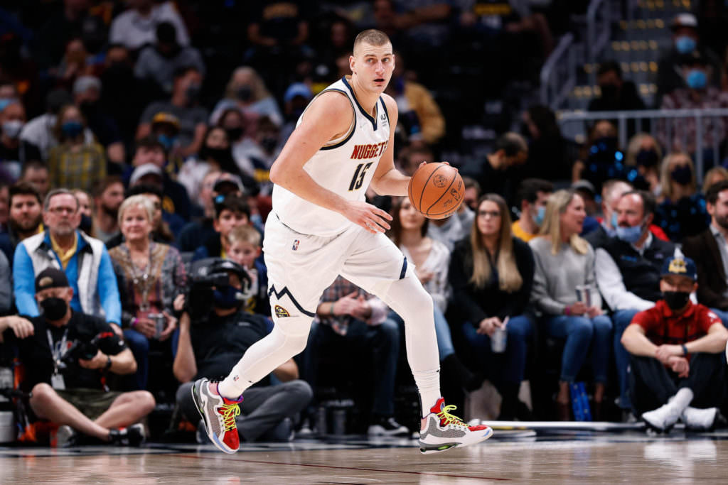 Denver Nuggets center Nikola Jokic (15) dribbles the ball in the second quarter against the Cleveland Cavaliers at Ball Arena