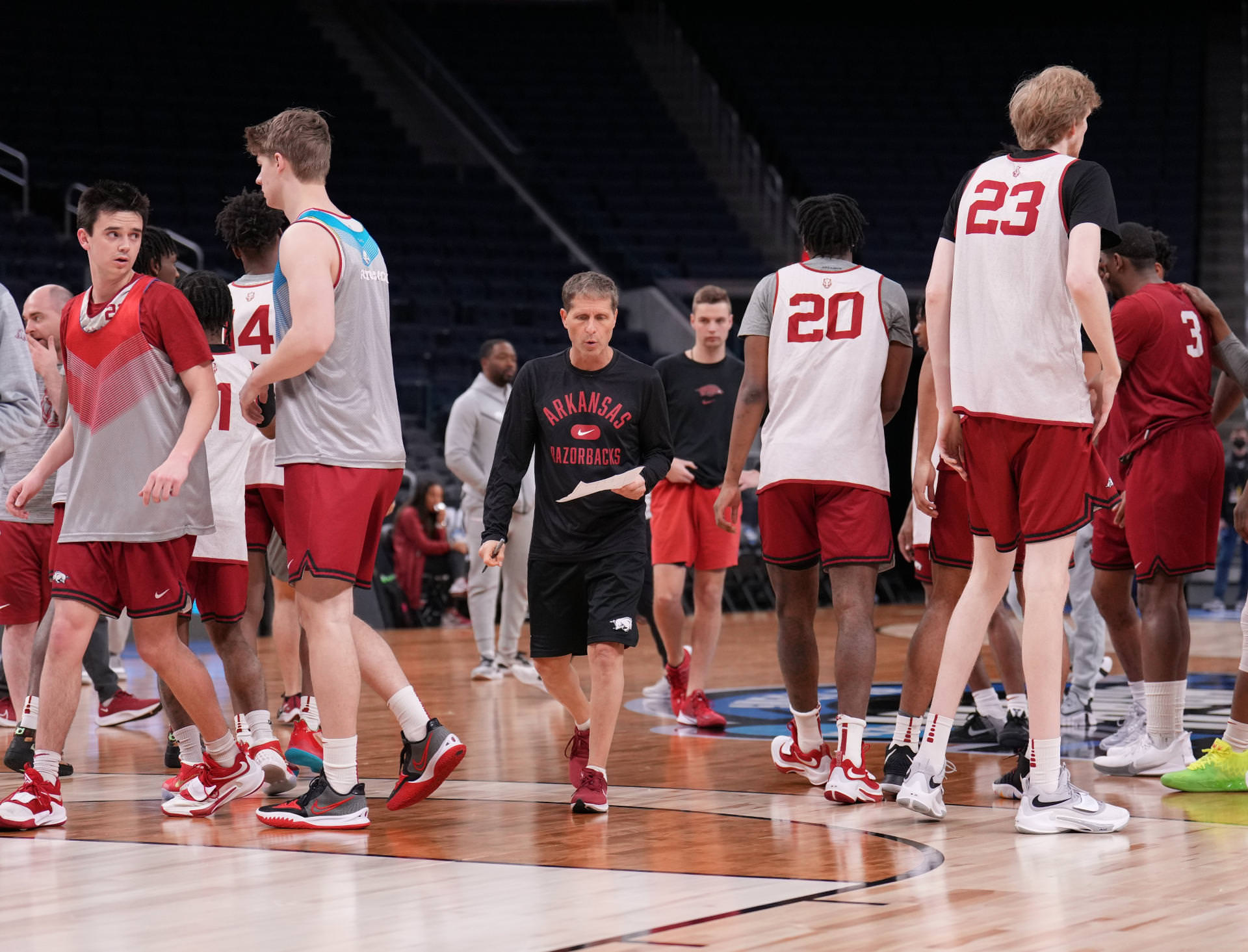 Arkansas Razorbacks head coach Eric Musselman walks between players during practice day of the NCAA Tournament West Regional at Chase Center