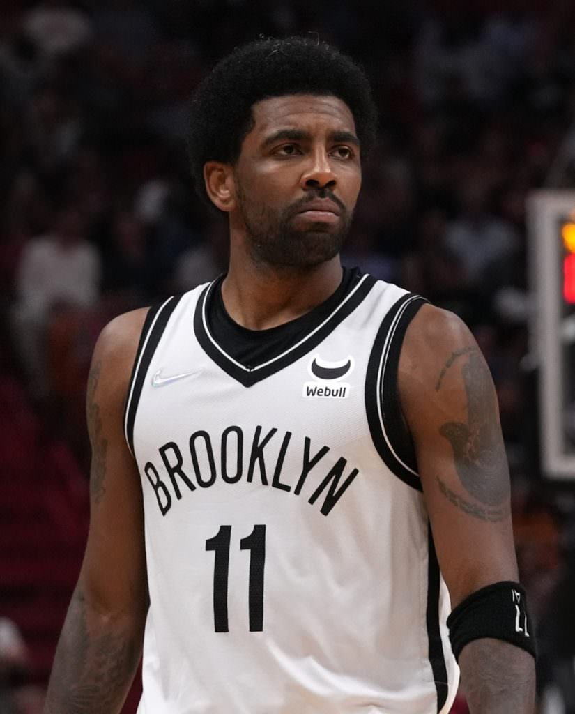 Brooklyn Nets guard Kyrie Irving (11) walks up the court 