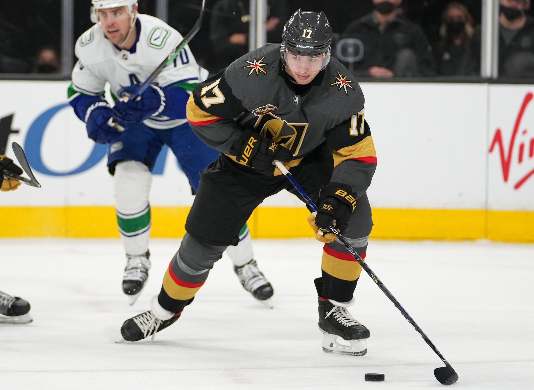 Vegas Golden Knights defenseman Ben Hutton (17) looks to pass the puck during the third period against the Vancouver Canucks