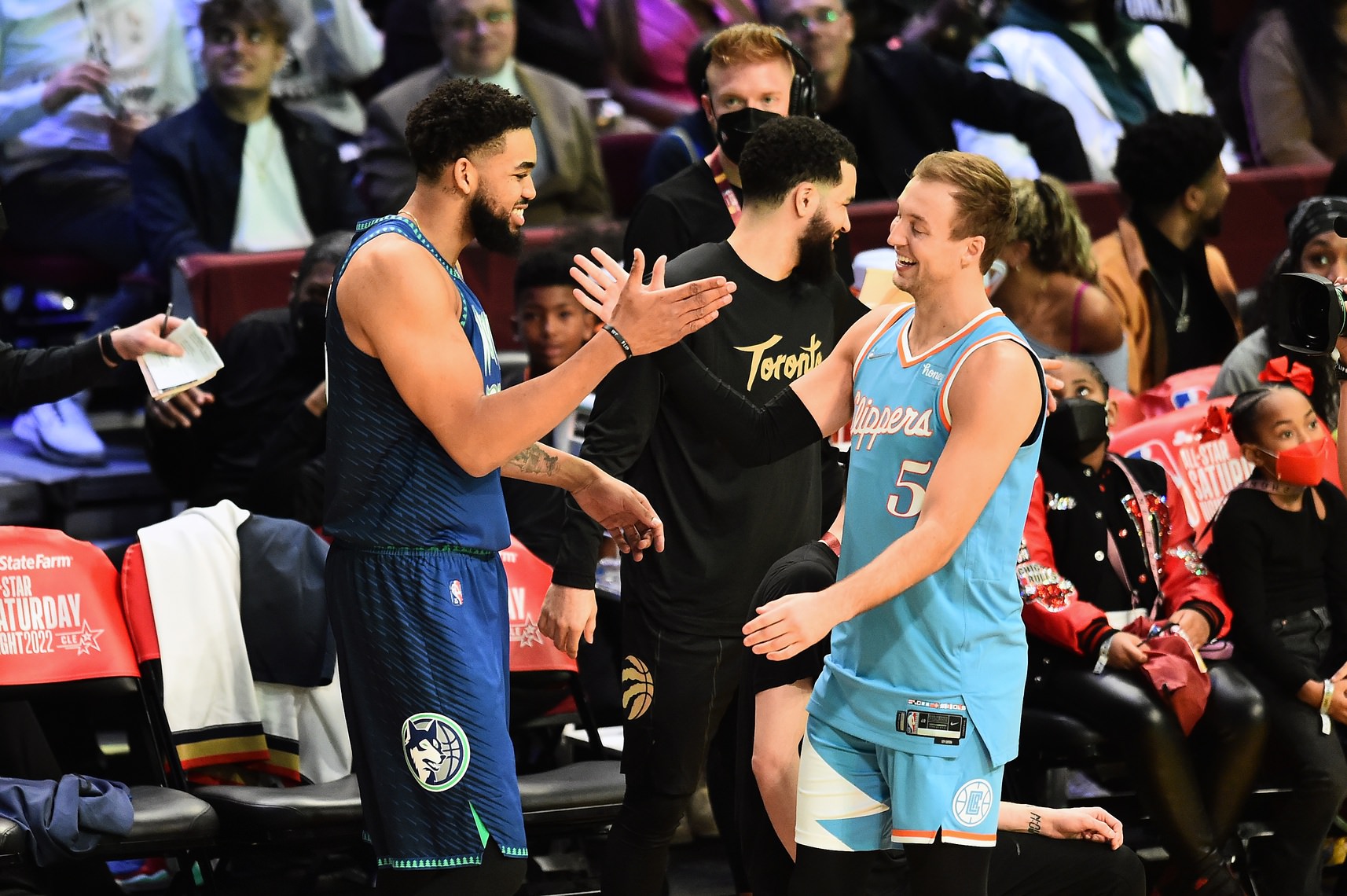 Minnesota Timberwolves center Karl-Anthony Towns (32) celebrates with Los Angeles Clippers guard Luke Kennard (5) after winning the three point contest during the 2022 NBA All-Star