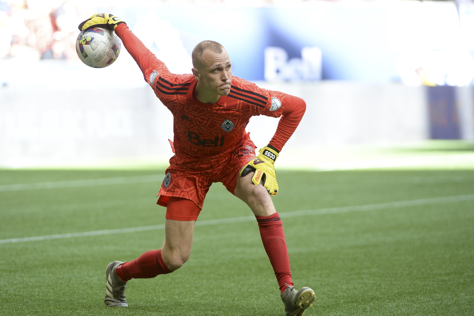 Jun 26, 2022; Vancouver, British Columbia, CAN; Vancouver Whitecaps goaltender Cody Cropper (55) throws in the ball against the New England Revolution during the first half at BC Place. Mandatory Credit: Anne-Marie Sorvin-USA TODAY Sports